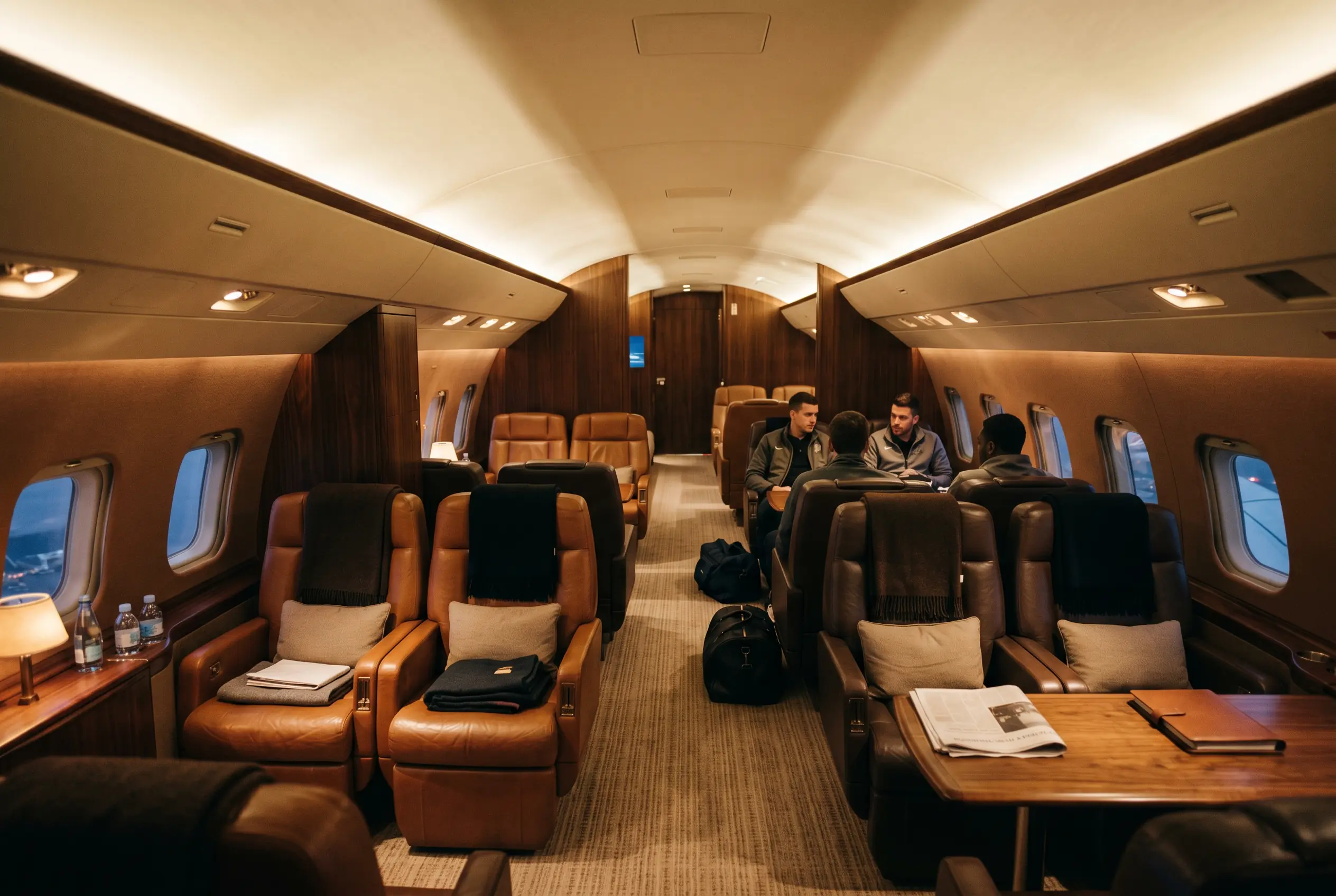 A spacious private-jet cabin laid out for a sports team on the New York to Miami route